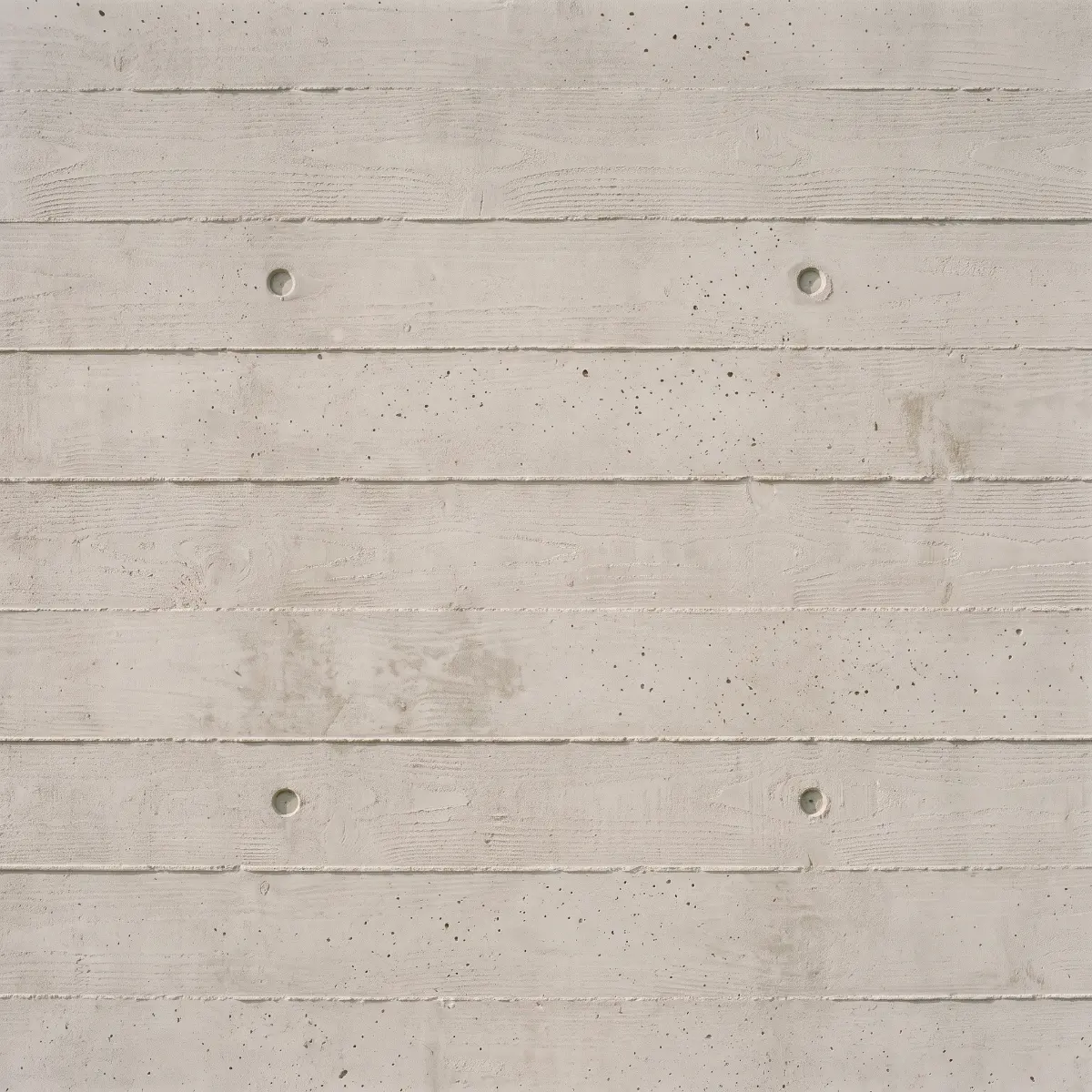 Board-marked concrete: the grain of the shuttering timber left in the surface.