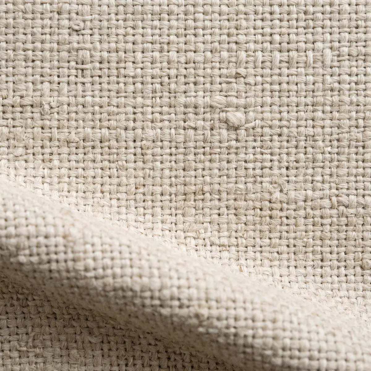 Linen bouclé, close: an undyed loose weave.